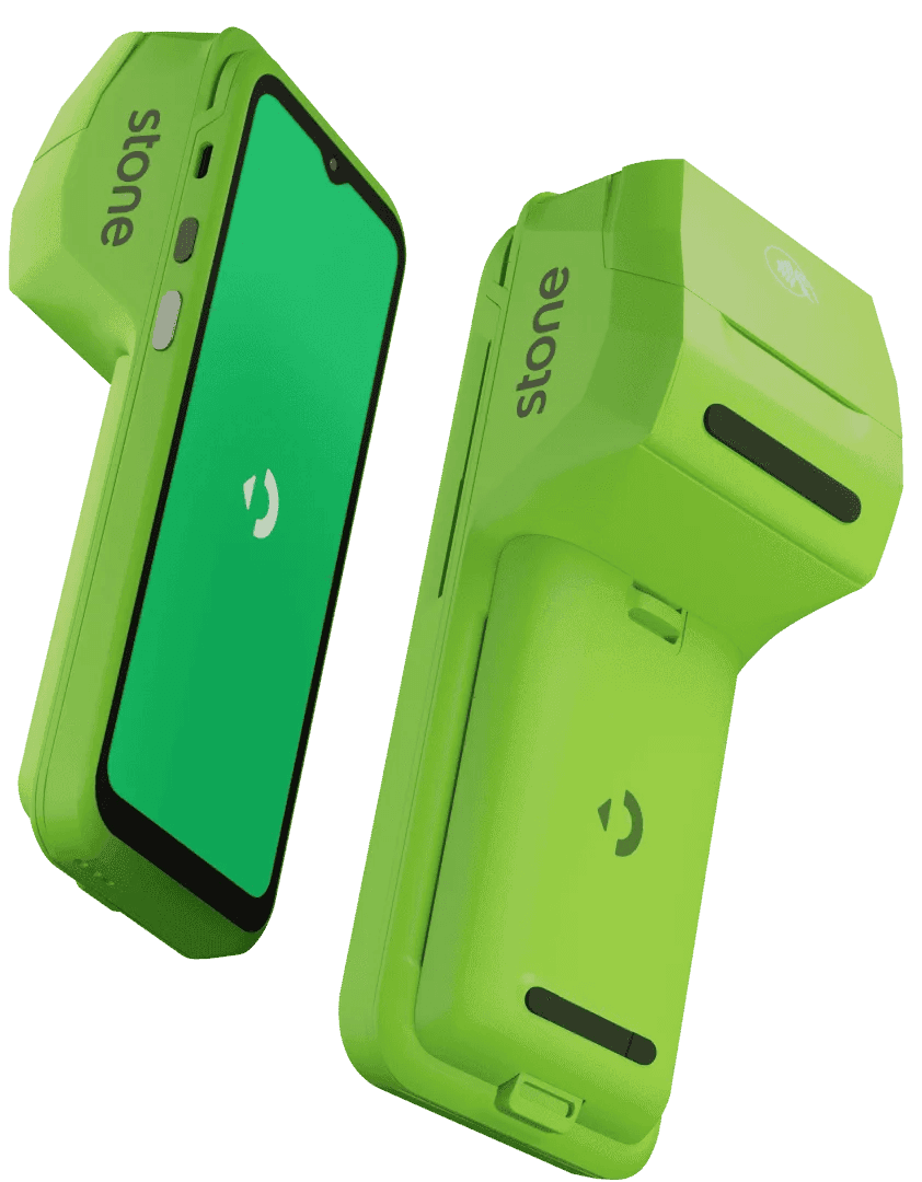 Dandara standing on a stage in front of a projected green screen, she is holding a mic and mid-speech